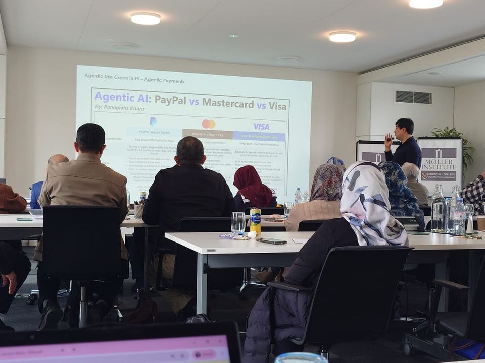 A lecture on digital payments with delegates seated at tables